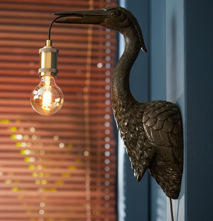 Wandlamp met gouden vogel van kunststof