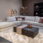 Stoffen beige hoekbank met liggedeelte