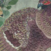 Paarse vogel op sierkussen textiel