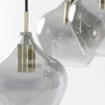 Bronzen details bij smoke glas vloerlamp
