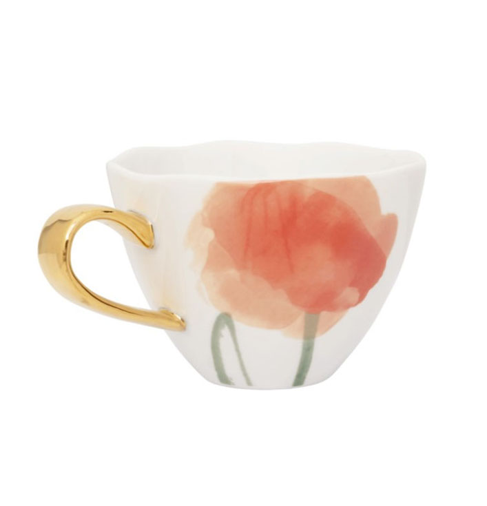 koffie kopje met bloem patroon en goud oortje