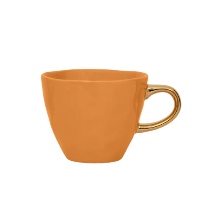 oranje kop voor koffie thee met gouden oortje