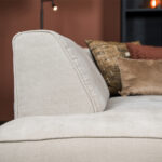 Vaste kussens beige hoekbank stof