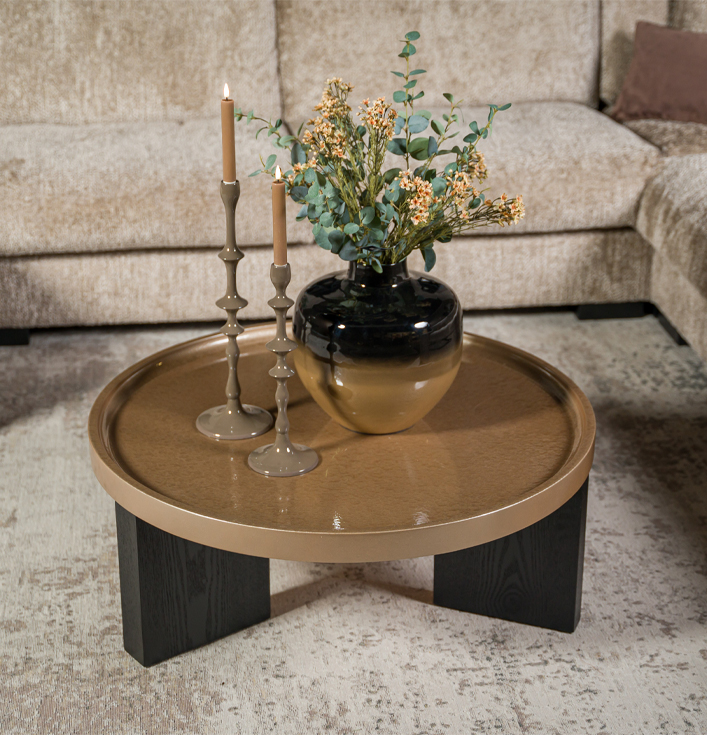 Ronde salontafel beige metaal met zwart houten poten