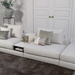 Beige stoffen bank met keramieken tussentafel