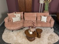 Hoekbank roze rond stof